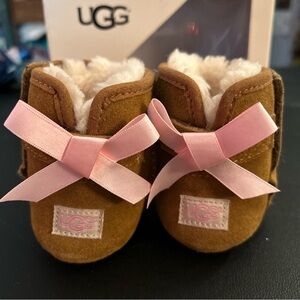 UGG Tan Baby Booties with Pink Ribbon size 2/3 which is 6-12 months-new in box